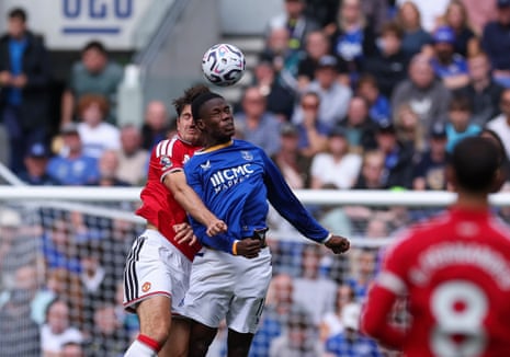 Manchester United's Harry Maguire clashes heads with Everton's Thierno Barry.