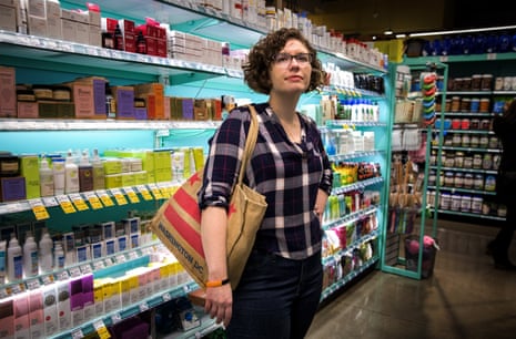 Emily Holden shops at the Whole Foods in their neighborhood in Washington, DC, February 23, 2019. Emily is the environment reporter for The Guardian US and has been wearing a silicone band developed by Oregon State University to measure chemicals from the surrounding environment over time. The wristbands can absorb volatile and semi-volatile compounds directly from the air and enable researchers to correlate location with air pollutants. 