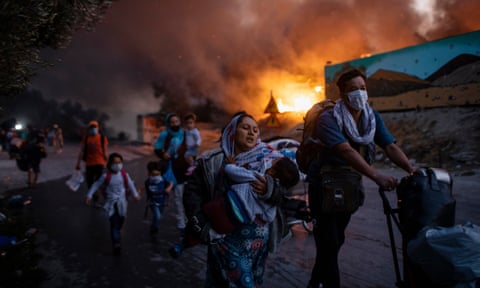 People fleeing a fire at the Moria camp on the Aegean island of Lesbos, Greece, in September 2020. 
