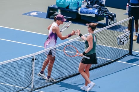 Iga Swiatek of Poland (L) shakes hands with Nadia Podoroska of Argentina after winning their Women’s Singles second round match.