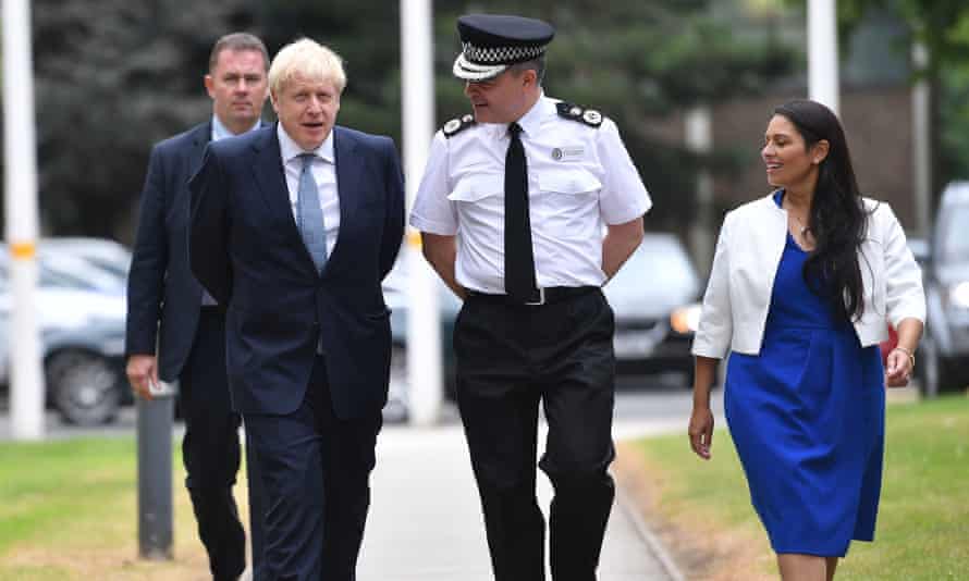 Boris Johnson and Priti Patel, the home secretary, arriving at West Midlands Police’s learning and development centre