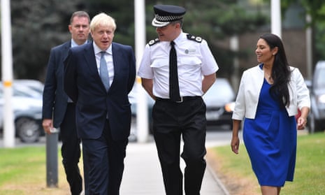 Boris Johnson and Priti Patel, the home secretary, arriving at West Midlands Police’s learning and development centre