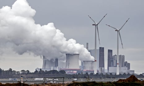 Coal-fired power station emits steam plumes near the Garzweiler surface mine in Germany.