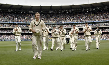 Shane Warne is applauded off the field by his teammates on day one of the fourth Ashes Test match at the MCG in 2006