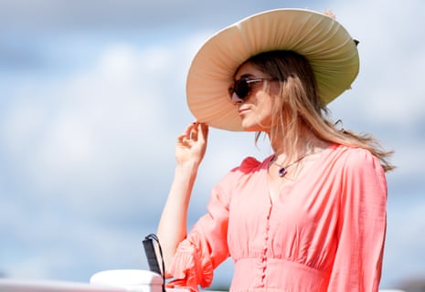 A racegoer admires the scene at Epsom on Oaks day.