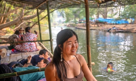 Yidan by a river near her farm in Thailand