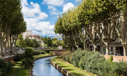 Perpignan's tree-lined Basse River on a sunny day