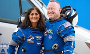 Suni Williams and Butch Wilmore stand together for a photo in their Nasa spacesuits