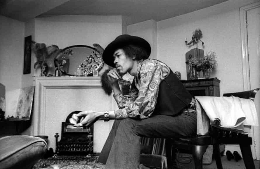 Jimi Hendrix in his apartment