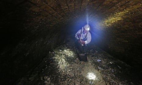 Water sewer supervisor Vince Minney works in the sewers beneath Regent Street in London.