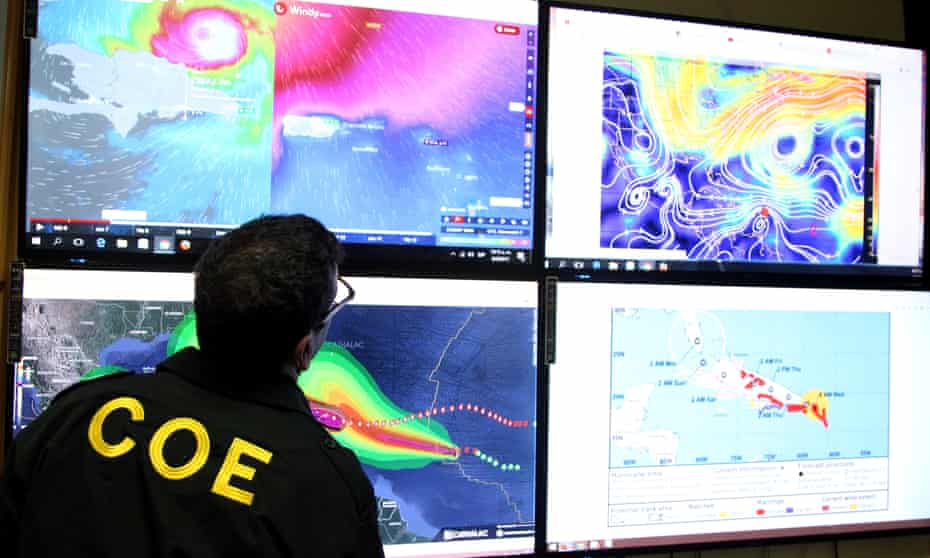 A emergency operations committee official monitors the trajectory of Hurricane Irma in Santo Domingo, Dominican Republic