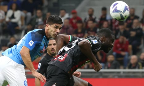 Giovanni Simeone (left) heads the winner for Napoli at Milan