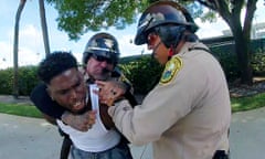 Miami Dolphins receiver Tyreek Hill is forced from his vehicle by Miami-Dade Police Department officers in Miami<br>Miami Dolphins receiver Tyreek Hill is forced to the ground after being handcuffed and led to the sidewalk by Miami-Dade Police Department officers in Miami, Florida, September 8, 2024 in a still image from police body camera video.  Miami-Dade Police Department/Handout via REUTERS. 
THIS IMAGE HAS BEEN SUPPLIED BY A THIRD PARTY