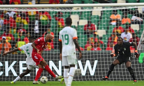 Equatorial Guinea’s Emilio Nsue slots the ball past Ivory Coast’s goalkeeper Yahia Fofana to open the scoring.