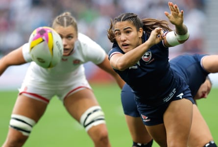 USA scrum-half Olivia Ortiz is watched by the England captain, Zoe Aldcroft, as she passes back.