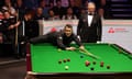 Ronnie O’Sullivan plays a shot against Ryan Day during their second-round match at the World Snooker Championship.