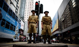 Members of a historical group pose in Hong Kong during an event marking 75 years since the British surrendered to the Japanese in WW2.