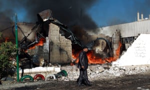 Flames rise from the ruins of buildings destroyed in an air-strike by the Saudi-led coalition in Yemen’s capital, Sana’a