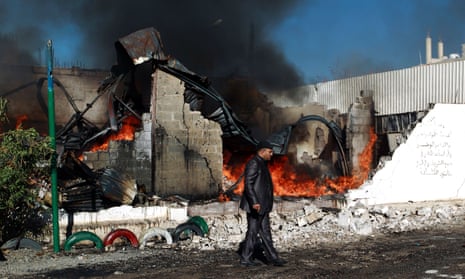 Aftermath of Saudi-led coalition airstrike as buidling burns