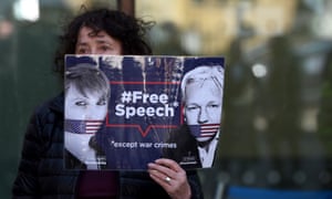 A protester outside Westminster magistrates court in London on 11 April.