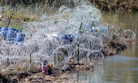 Razor and concertina wire, installed by the Texas national guard, is seen in Shelby Park at the US-Mexico border in Eagle Pass, Texas, on 16 January.