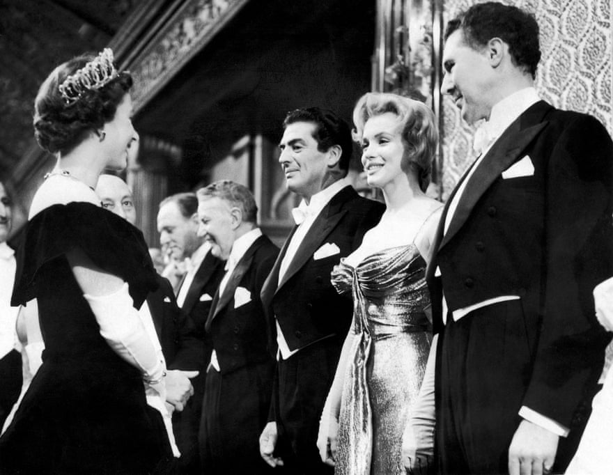 Sphinx-like … with Marilyn Monroe at a Royal Command Performance in 1956.