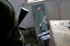 Luhansk, UkraineA militant of the self-proclaimed Luhansk People’s Republic is reflected in a mirror at a fighting position on the line of separation from the Ukrainian armed forces.