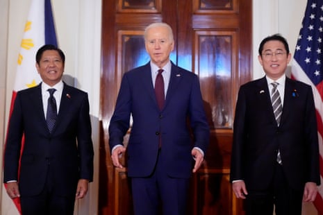 President Joe Biden, centre, speaks alongside Philippine President Ferdinand Marcos Jr., left, and Japanese Prime Minister Fumio Kishida before a trilateral meeting in the East Room the White House in Washington