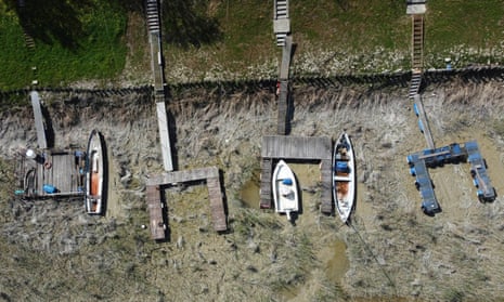 Boats lie on the dried shipyard on the Po river in Torricella, near Parma, Italy.