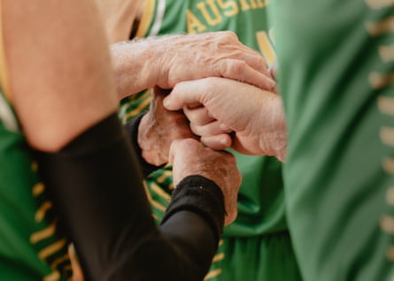 A detail of the Australia Men’s Over 80 basketball team huddle during a game in Bellinzona, Switzerland