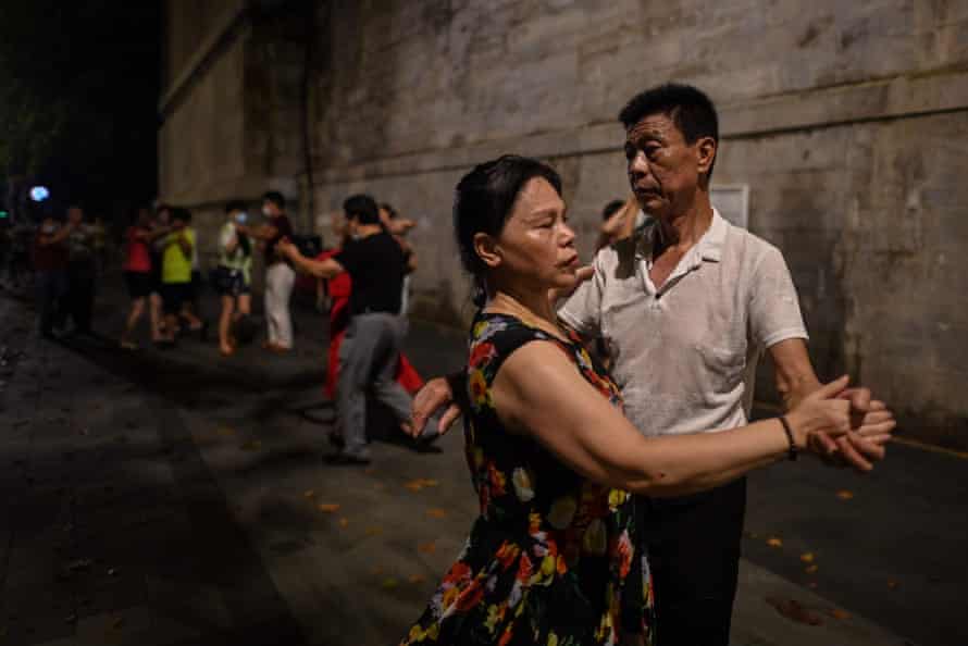 ouples dancing next to the Yangtze River in Wuhan in Chinas central Hubei province, 5 August