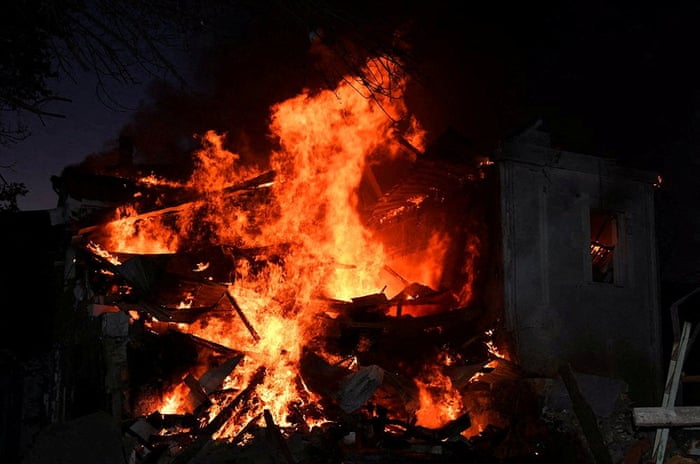 An image released by Ukraine’s state emergency service showing a residential building burns in Mykolaiv,.