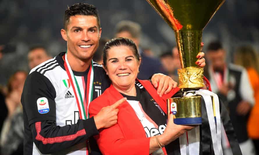 Cristiano Ronaldo and his mother, Dolores Aveiro, pose with the trophy after winning Serie A with Juventus in 2019.