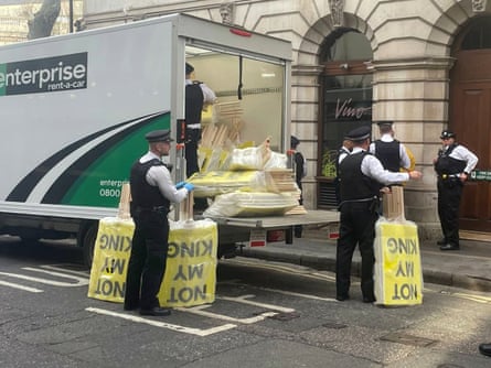 Met police officers confiscate anti-monarchy protest material in central London on the day of King Charles’s coronation