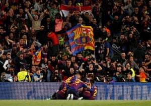 Barcelona’s Lionel Messi celebrates scoring their third goal with teammates.