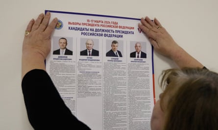 A member of a local electoral commission prepares a polling station on 14 March for the presidential election in Moscow