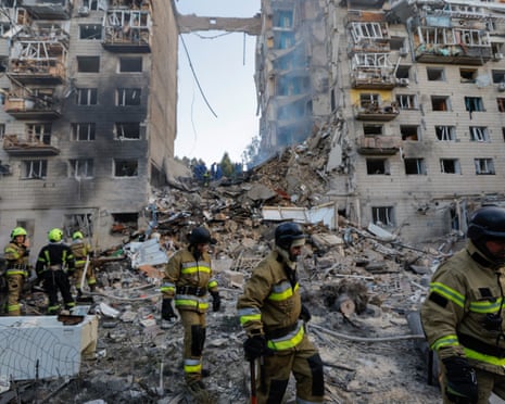 Ukrainian rescuers work at the site of an airstrike on a nine-story residential building in Kyiv, Ukraine.