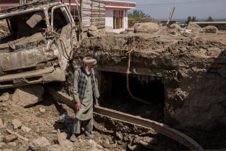 Khoja Zada stands in front of what is left of his house in Charikar, Parwan.