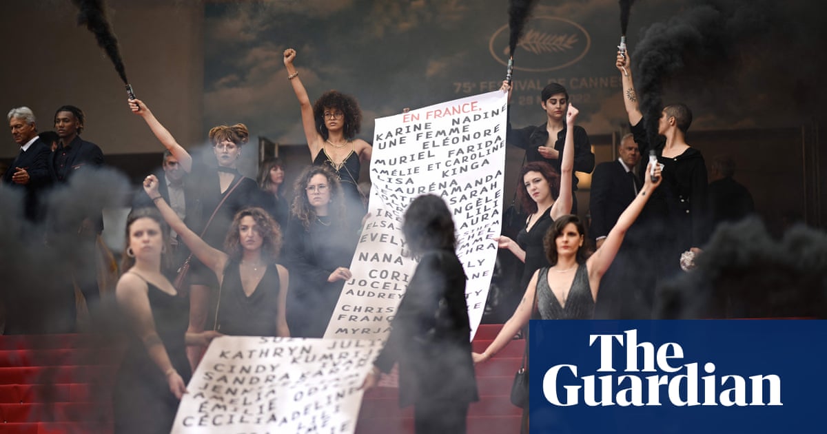 Feminist collective deploys banner and smoke bombs on Cannes red carpet – video
