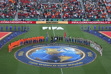 The Morocco and Netherlands players line up ready to exercise their vocal chords with the national anthems.