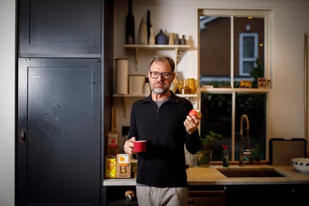 Tim Dowling holds an apple