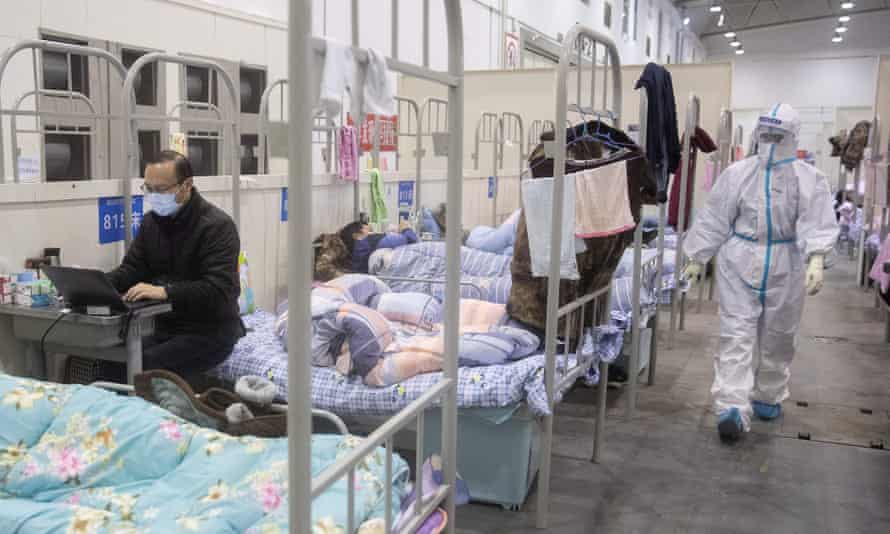 People at an exhibition centre converted into a hospital in Wuhan, China