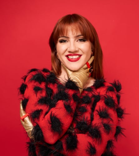Portrait of CMAT in red top
