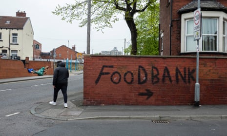 A food bank sign graffitied on a wall in Leeds