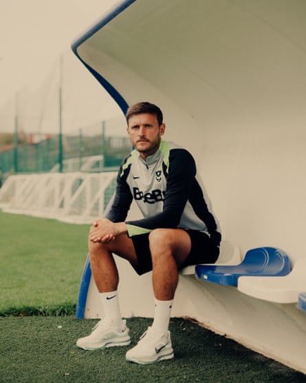 John Swift sits in a dugout at Portsmouth’s training ground