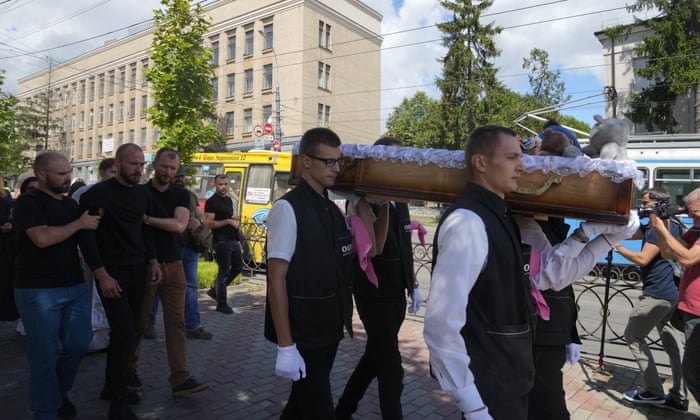 Men carry a coffin during a funeral ceremony for Liza, a four-year-old girl killed by a Russian attack in Vinnytsia