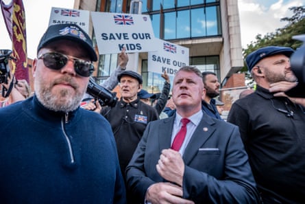 Paul Golding surrounded by protesters