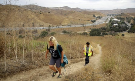 Beth Pratt of the National Wildlife Federation and Caltrans project manager Sheik Moinuddin walk near the planned wildlife crossing.