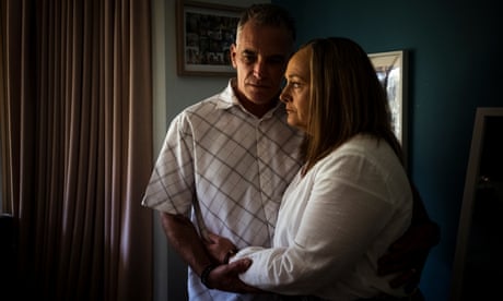 Joan and Richard Cocks hold each other in their daughter Bridie's bedroom. Bridie took her life in October last year. Photograph by Christopher Hopkins for The Guardian