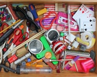 Junk drawer full of various household objects